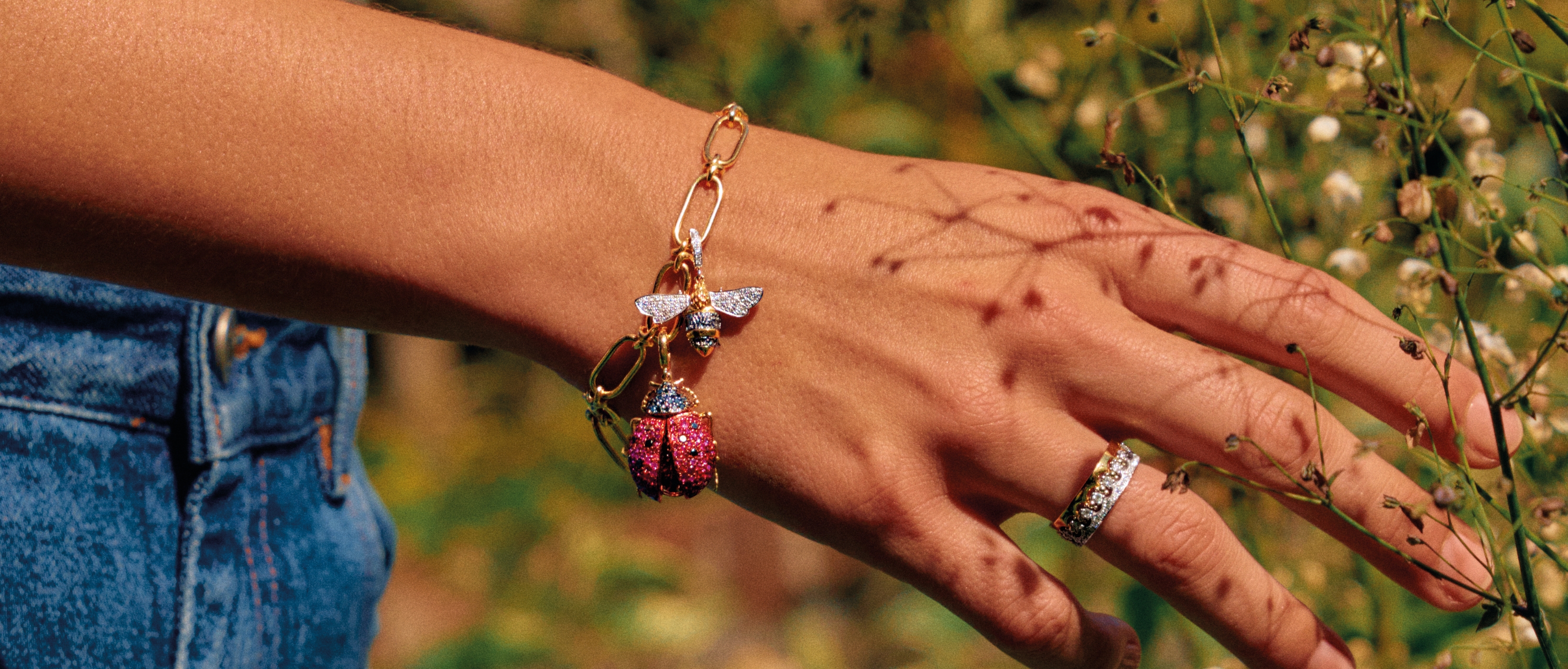 charm bracelet featuring bee and a ladybird
