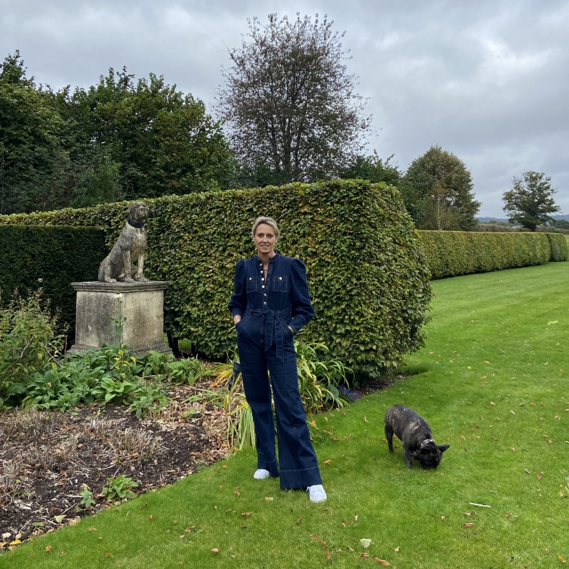 woman with bulldog in garden 