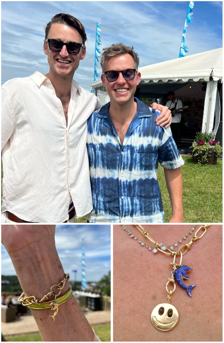 two men smiling for camera, bert the dolphin charm being worn on bracelet and necklace