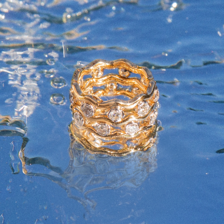 diamond and gold ring in water 